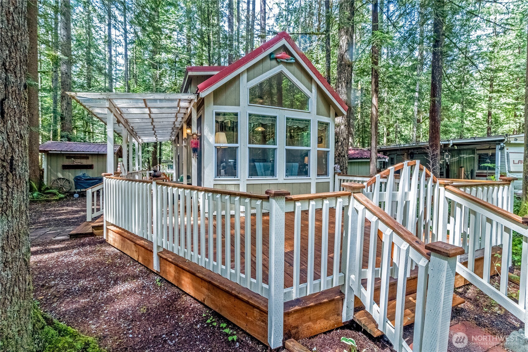 a view of a house with a yard and deck