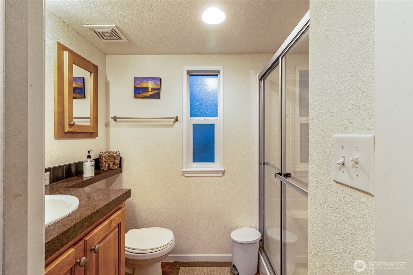 86-3 Sunset Circle Maple Falls, WA 98266 - Photo 18 of 38 a bathroom with a granite countertop toilet a sink and a mirror