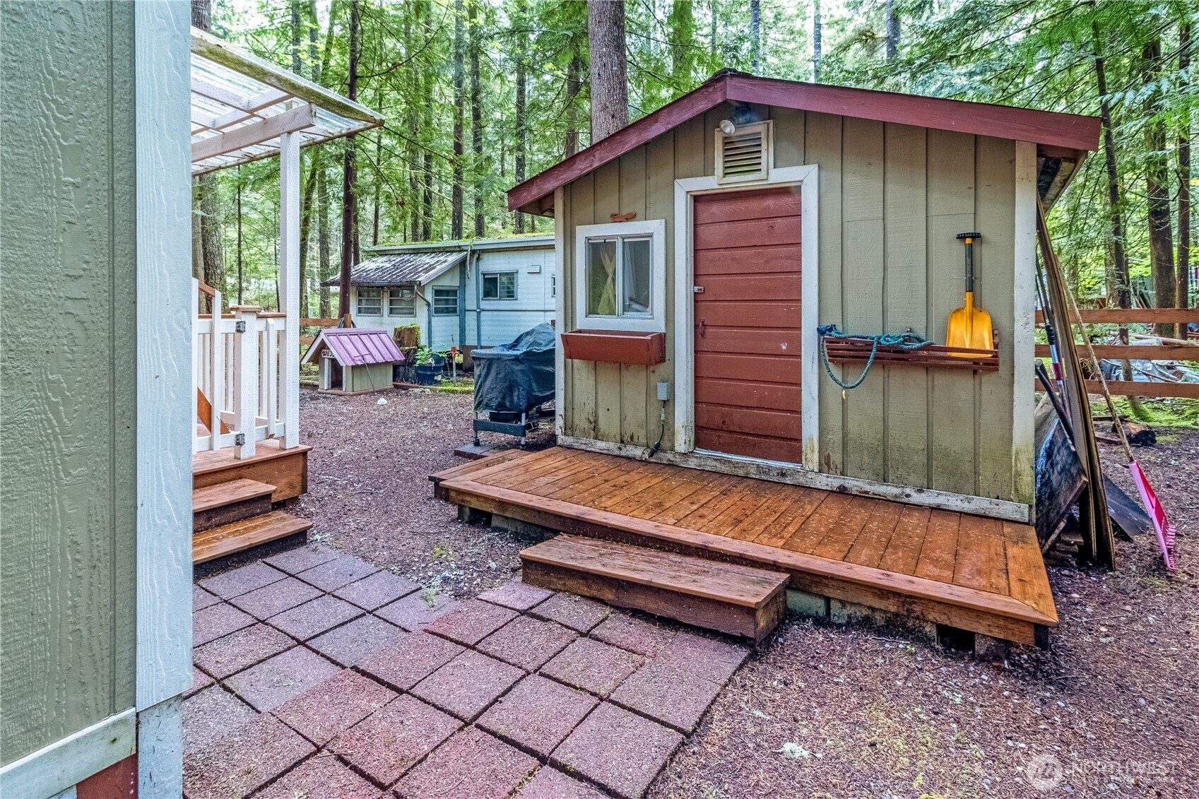 86-3 Sunset Circle Maple Falls, WA 98266 - Photo 25 of 38 a backyard of a house with barbeque oven table and chairs