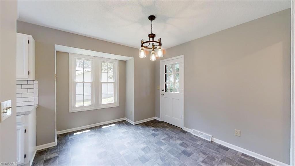 317 Staplewood Road Lexington, NC 27295 - Photo 11 of 34 Breakfast Room w/door onto deck, new light fixture