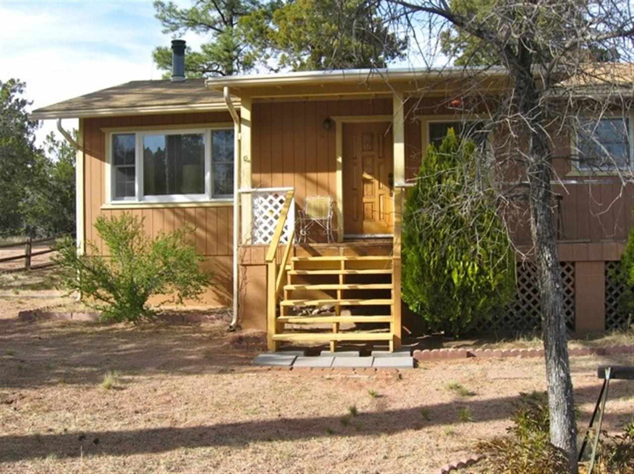 3060 A Chevelon Road Overgaard, AZ 85933 - Photo 1 of 14 a front view of a house