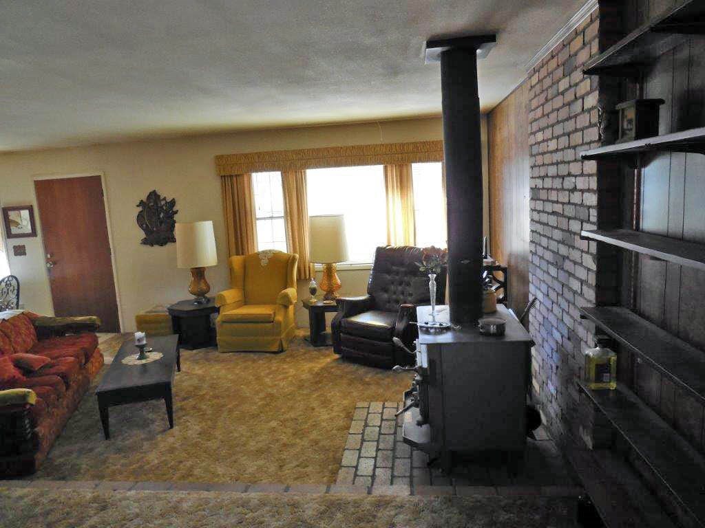 3060 A Chevelon Road Overgaard, AZ 85933 - Photo 2 of 14 a living room with furniture wooden floor and a large window