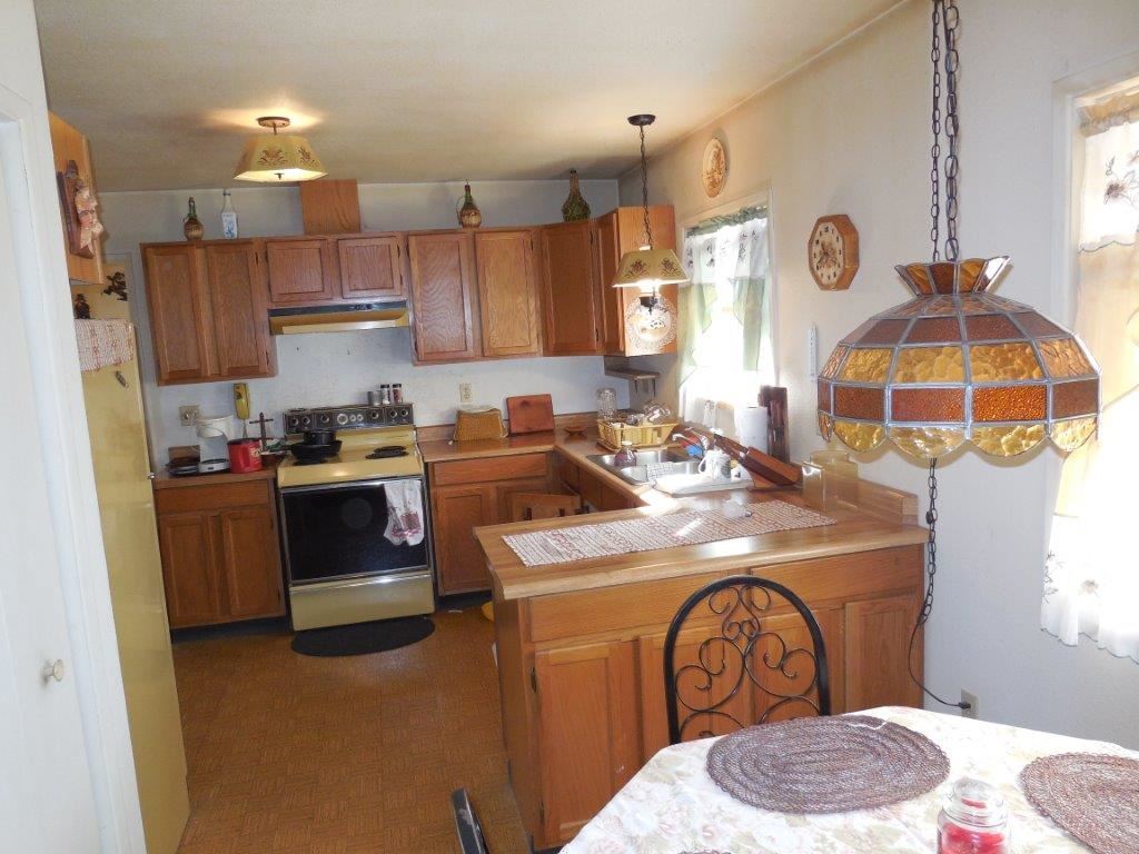 3060 A Chevelon Road Overgaard, AZ 85933 - Photo 5 of 14 a kitchen with a sink appliances and cabinets