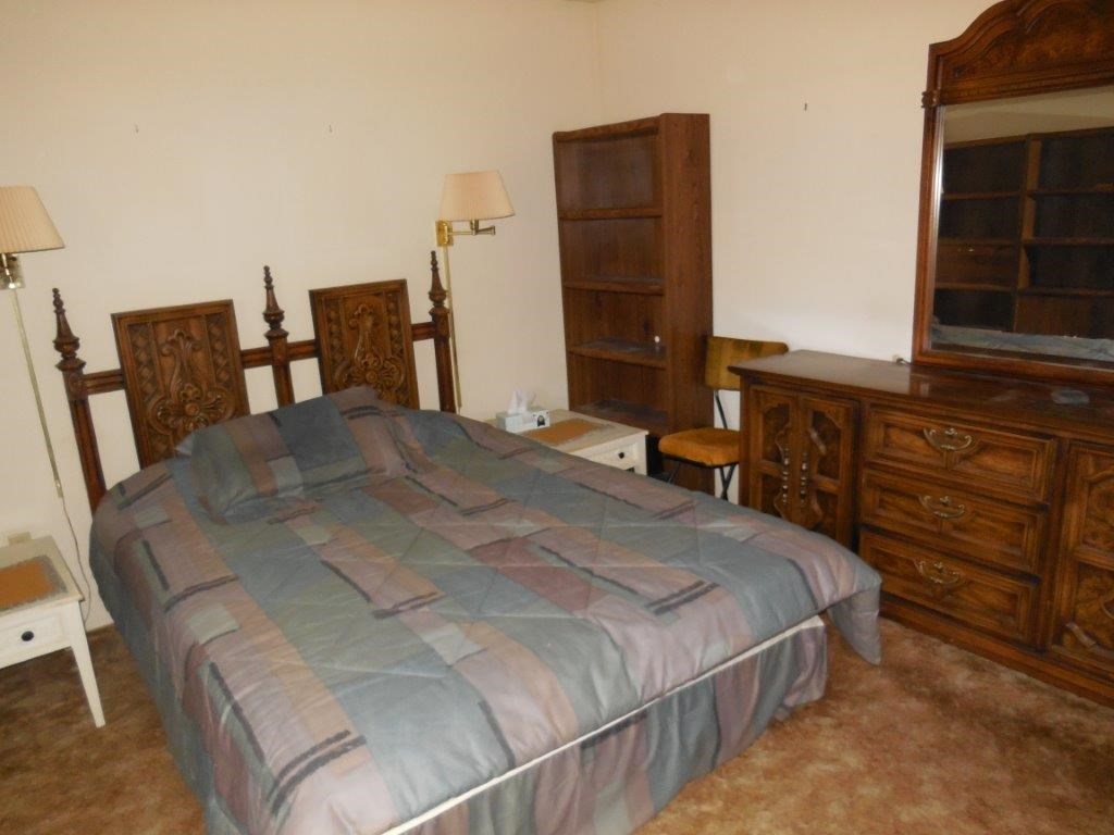 3060 A Chevelon Road Overgaard, AZ 85933 - Photo 7 of 14 a bedroom with a bed and furniture