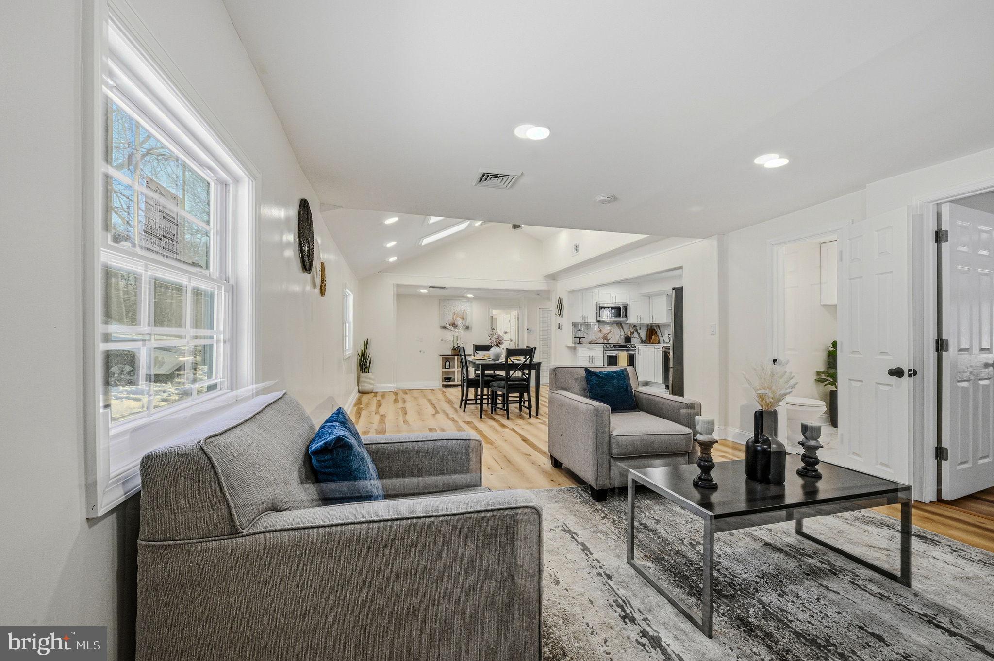 4 Lower Greenbriar Road Wilmington, DE 19810 - Photo 13 of 42 a living room with furniture and a large window