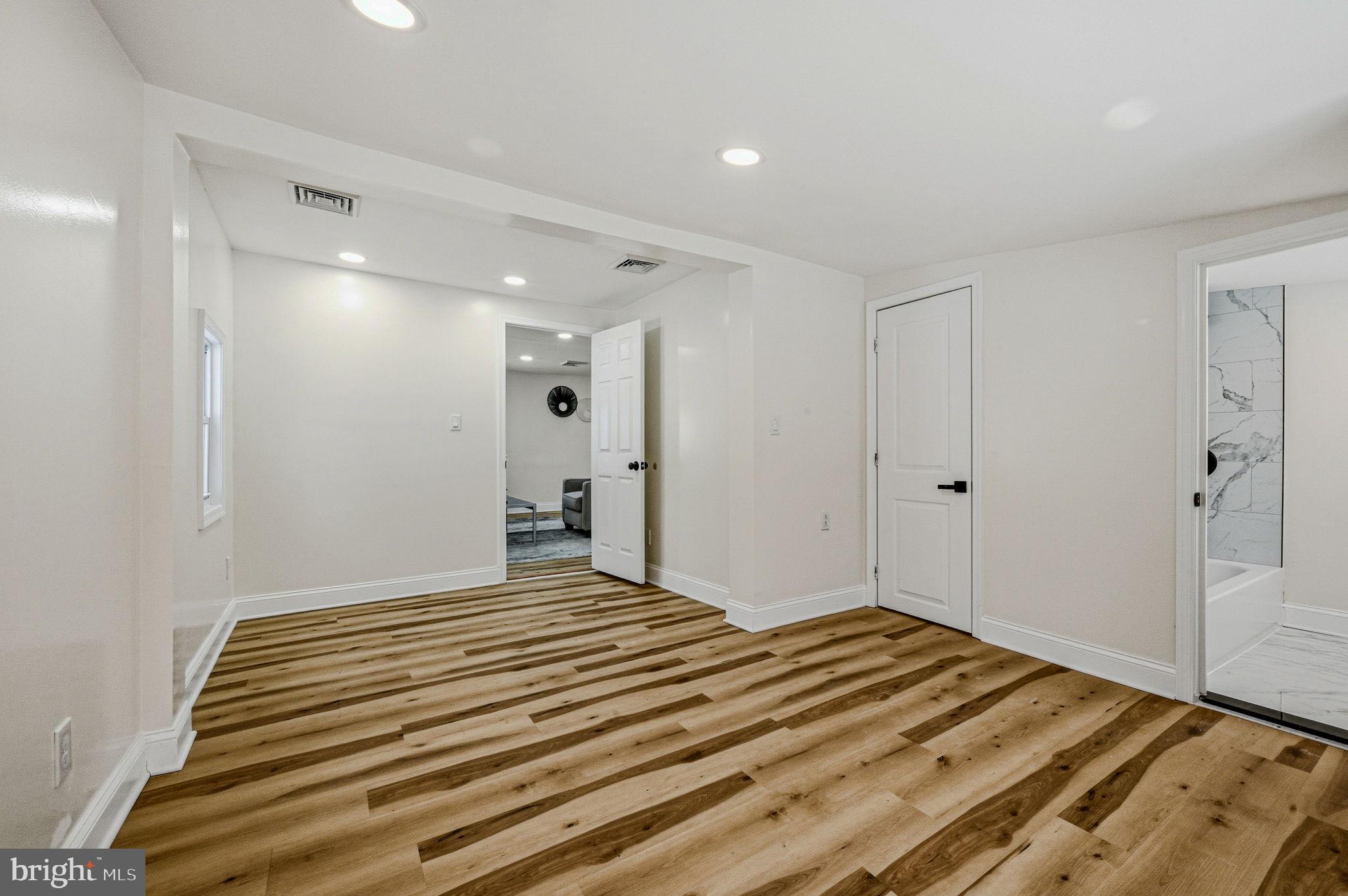 4 Lower Greenbriar Road Wilmington, DE 19810 - Photo 19 of 42 a bedroom with a bed and a painting