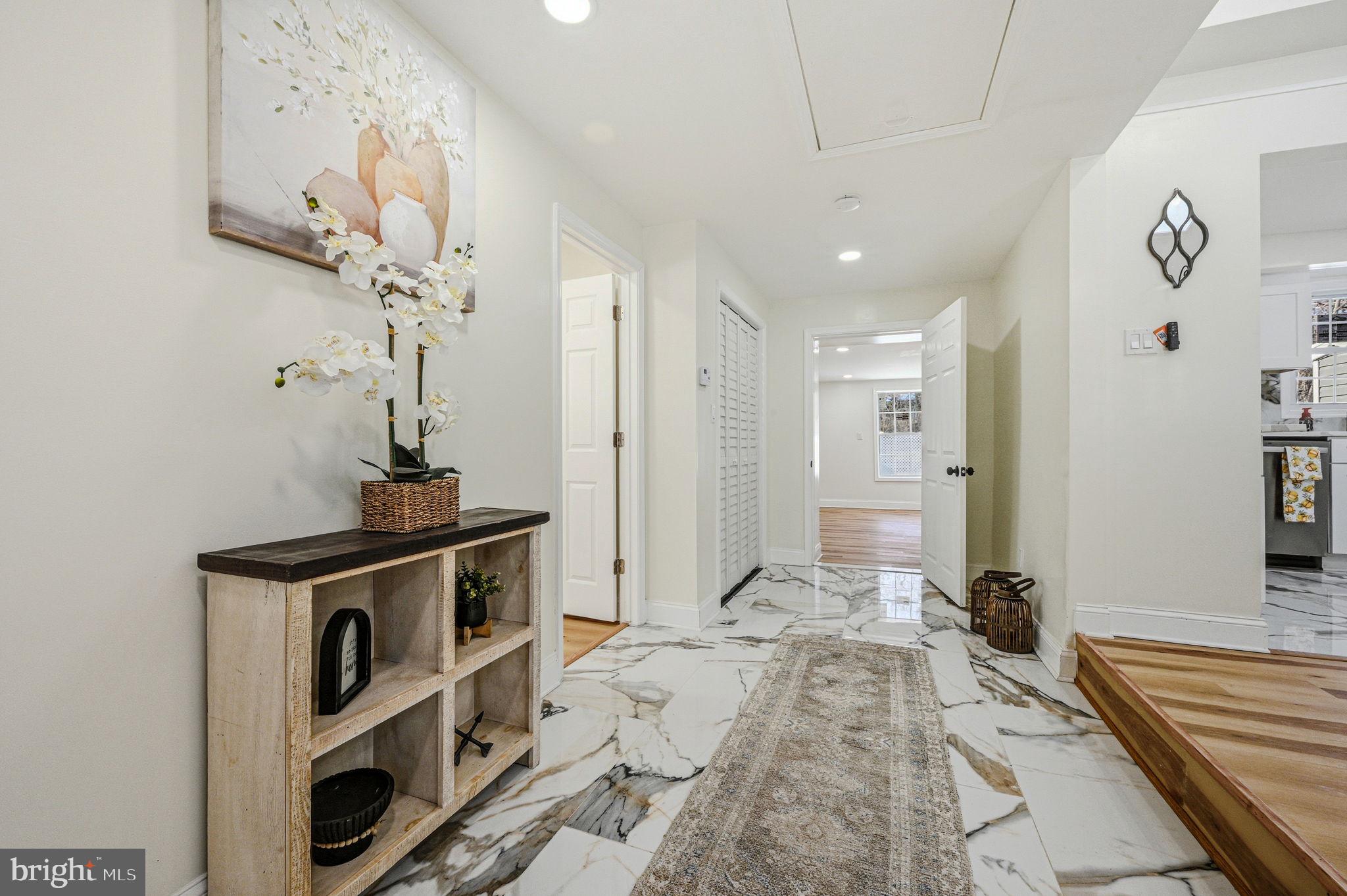 4 Lower Greenbriar Road Wilmington, DE 19810 - Photo 3 of 42 a view of a hallway with entryway wooden floor and front door