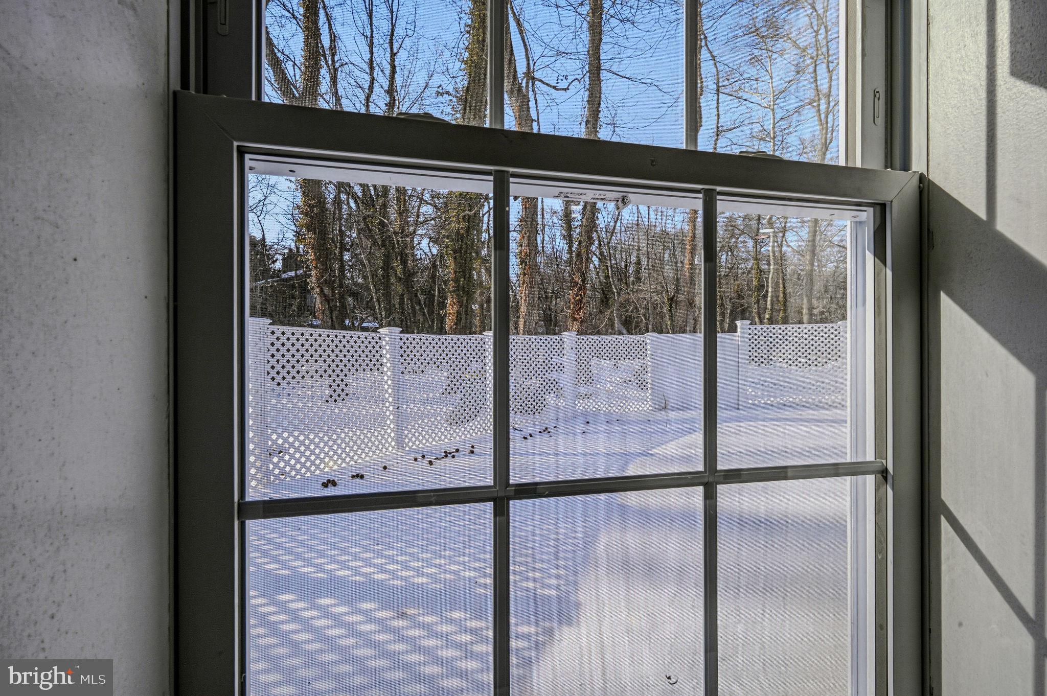4 Lower Greenbriar Road Wilmington, DE 19810 - Photo 33 of 42 a view of a glass door with a yard from a window