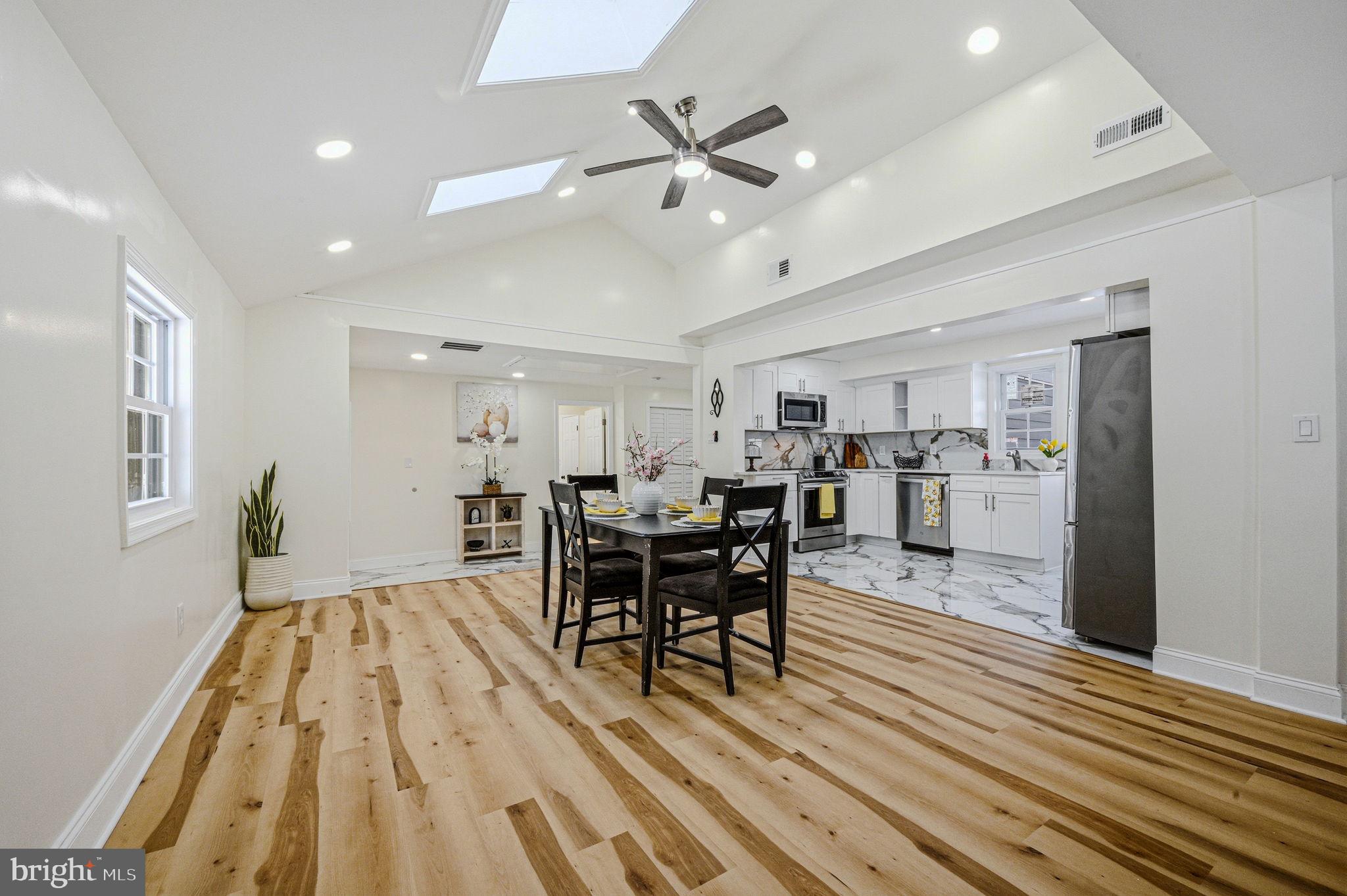 4 Lower Greenbriar Road Wilmington, DE 19810 - Photo 7 of 42 a view of a dining room with furniture and wooden floor