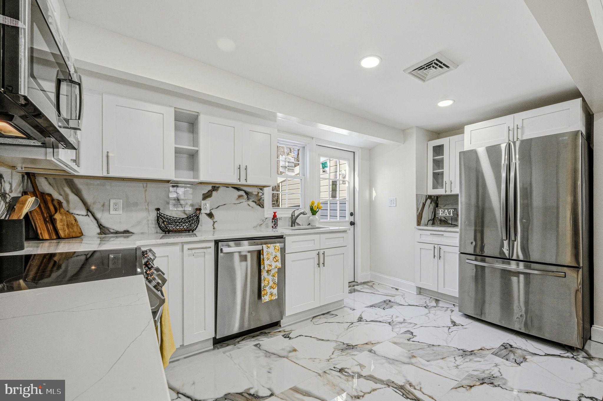 4 Lower Greenbriar Road Wilmington, DE 19810 - Photo 9 of 42 a kitchen with stainless steel appliances granite countertop a refrigerator and a sink