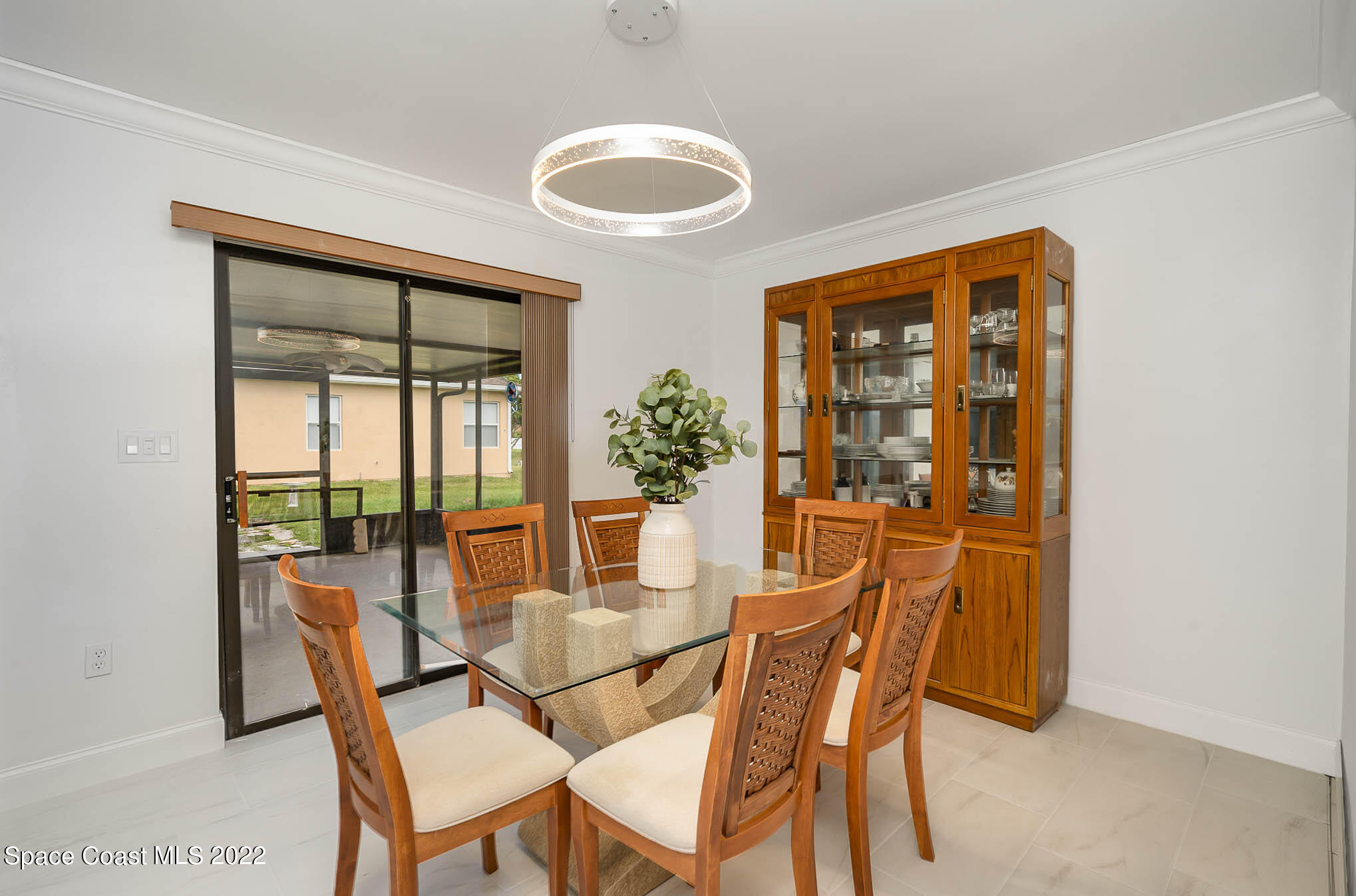 412 Godfrey Road Southeast Palm Bay, FL 32909 - Photo 12 of 22 a dining room with furniture and wooden floor