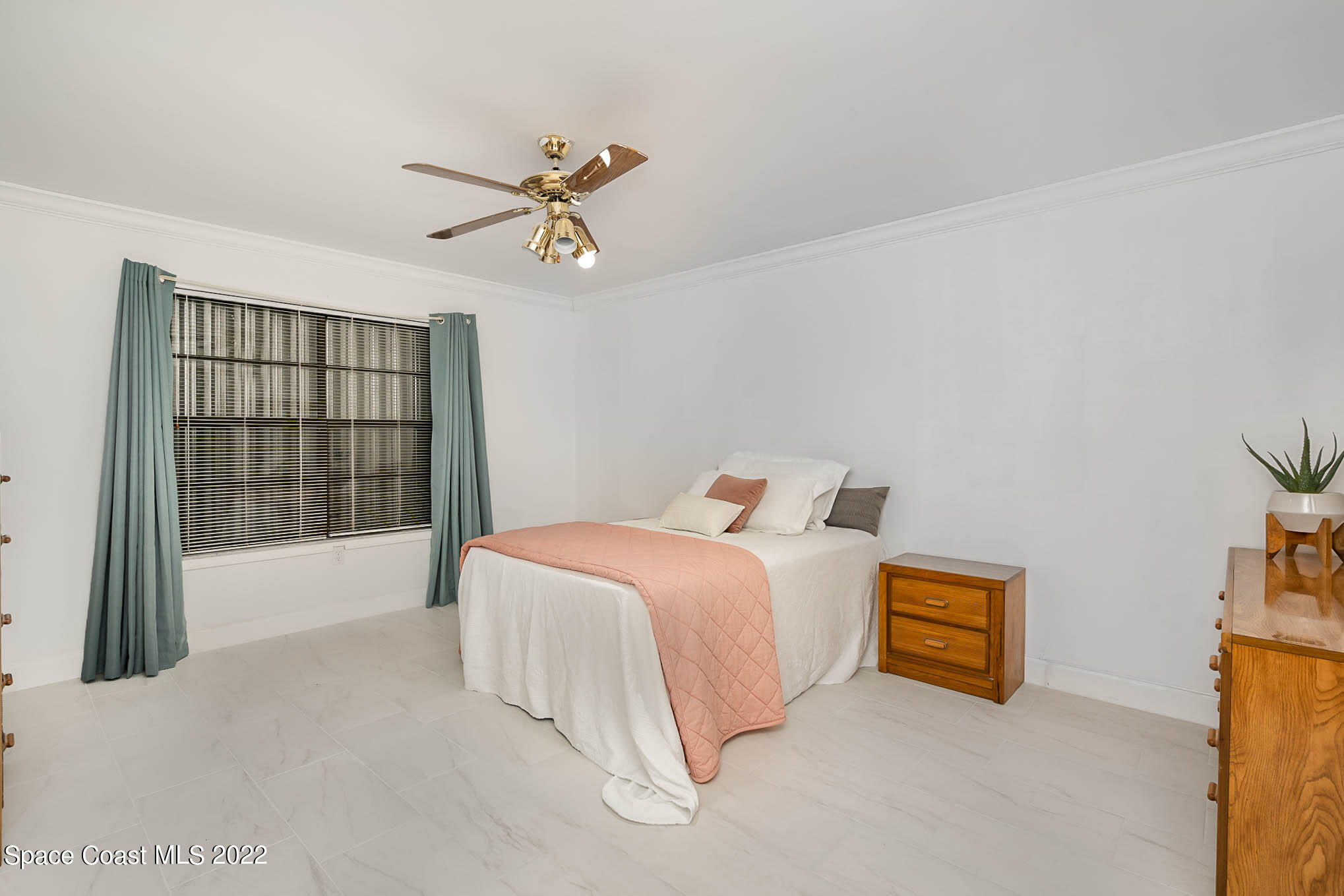 412 Godfrey Road Southeast Palm Bay, FL 32909 - Photo 14 of 22 a bedroom with a bed and a window