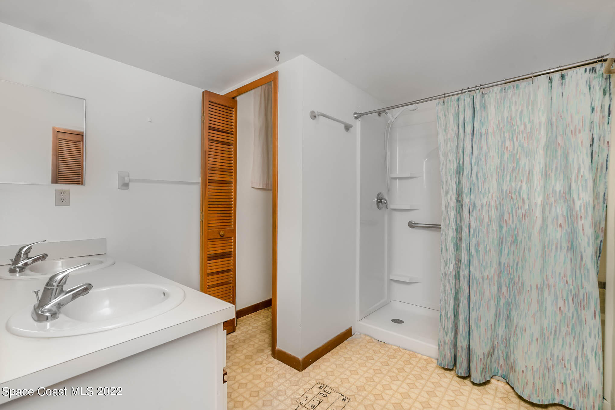 412 Godfrey Road Southeast Palm Bay, FL 32909 - Photo 17 of 22 a bathroom with a sink a toilet and shower