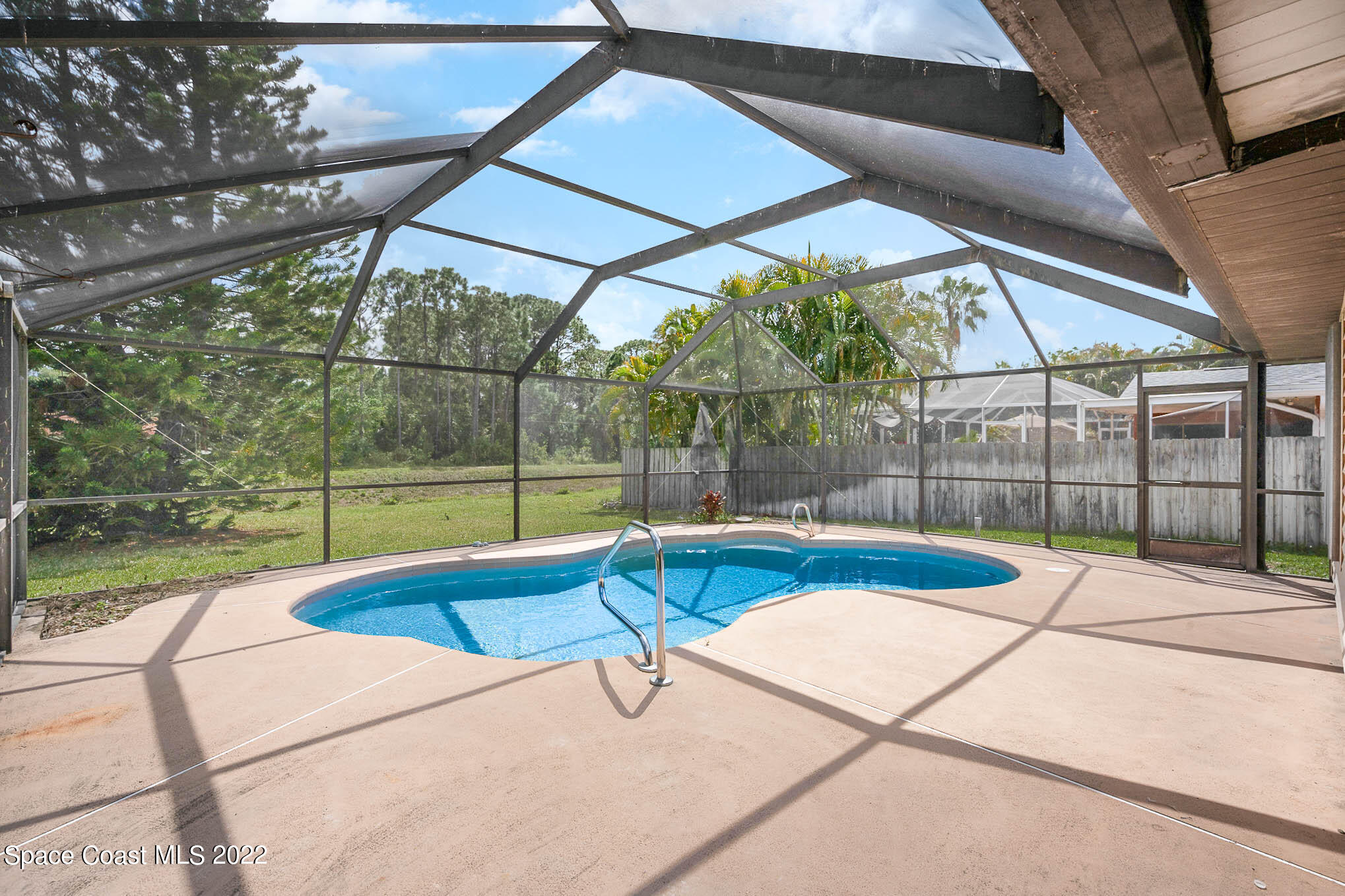 412 Godfrey Road Southeast Palm Bay, FL 32909 - Photo 3 of 22 a view of outdoor space with swimming pool