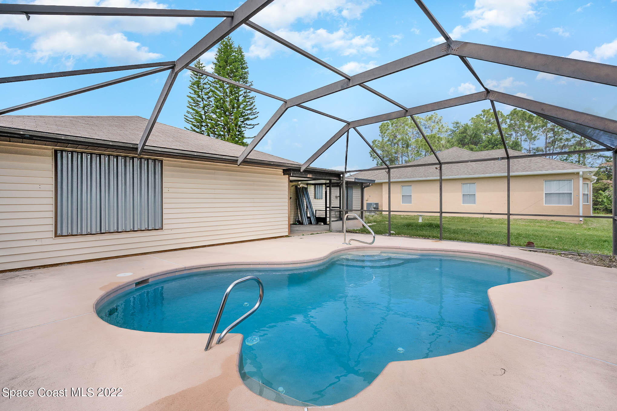 412 Godfrey Road Southeast Palm Bay, FL 32909 - Photo 4 of 22 a view of a backyard with a sink and wooden floor
