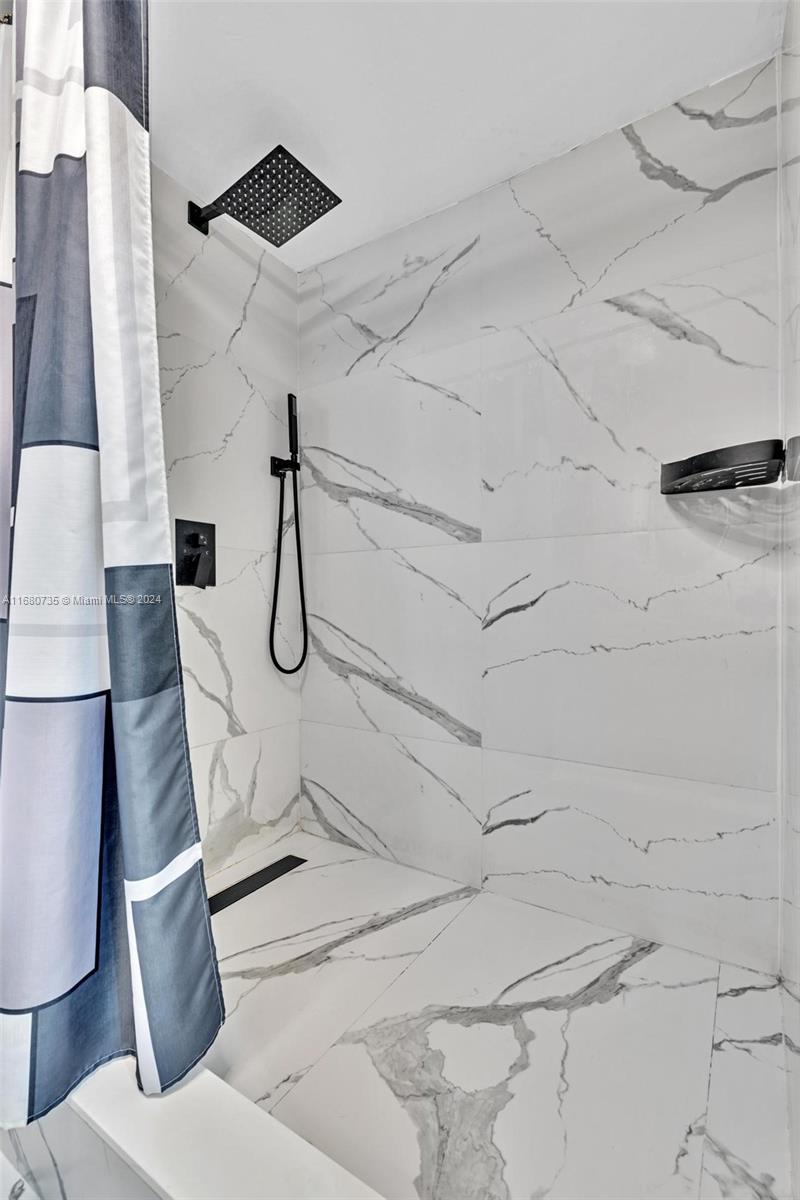 4328 Southwest 49th Court, Unit 2 Dania Beach, FL 33314 - Photo 11 of 18 a bathroom with a shower