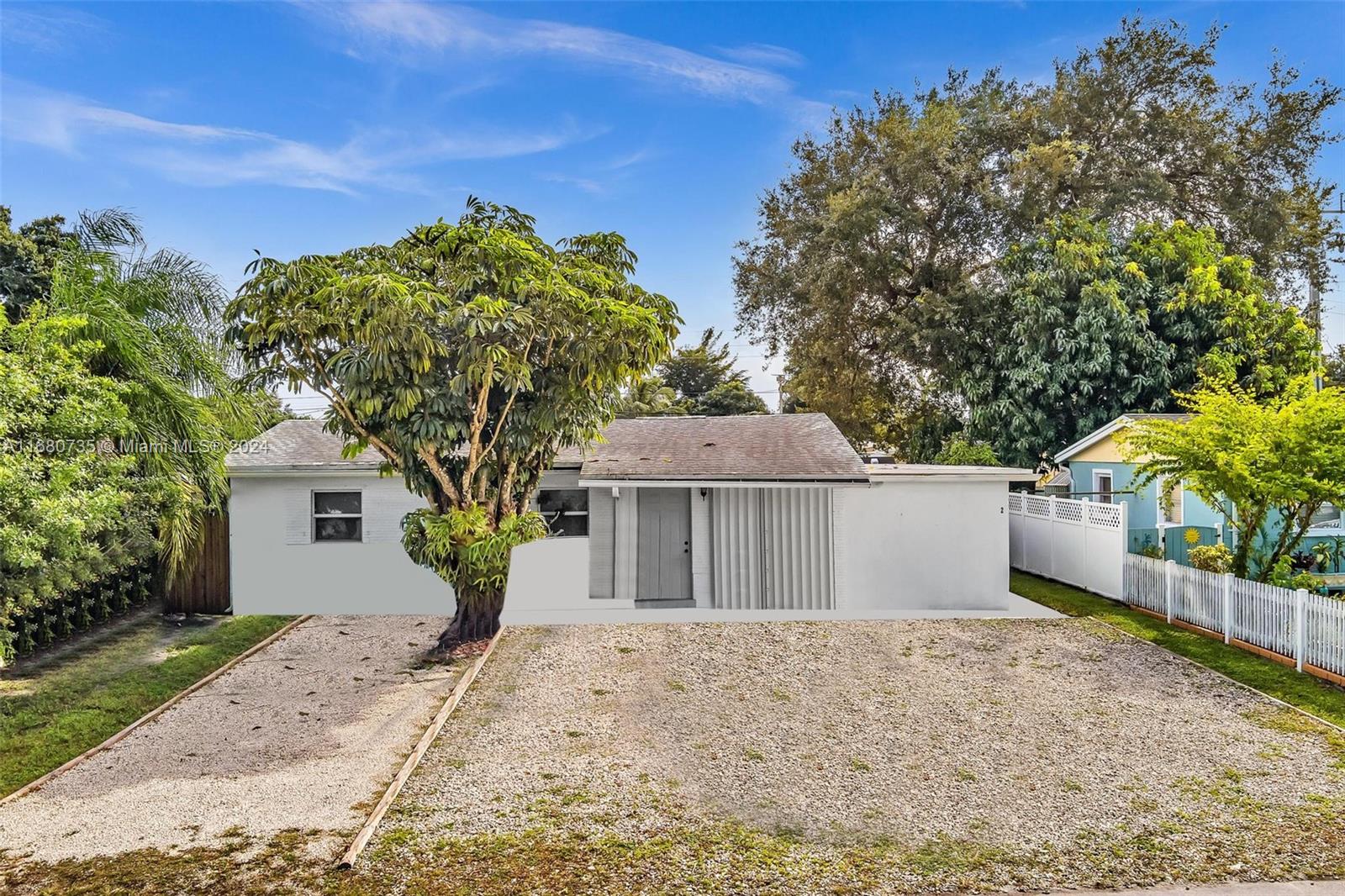4328 Southwest 49th Court, Unit 2 Dania Beach, FL 33314 - Photo 12 of 18 front view of a house with a yard