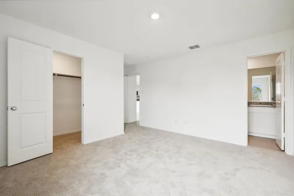 an empty room with a bathroom