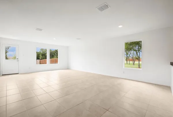 a view of an empty room with a window
