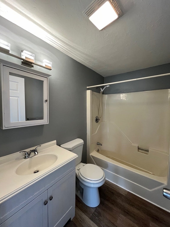 1475 Braley Road, Unit 17 New Bedford, MA 02745 - Photo 4 of 9 a bathroom with a sink mirror toilet and shower