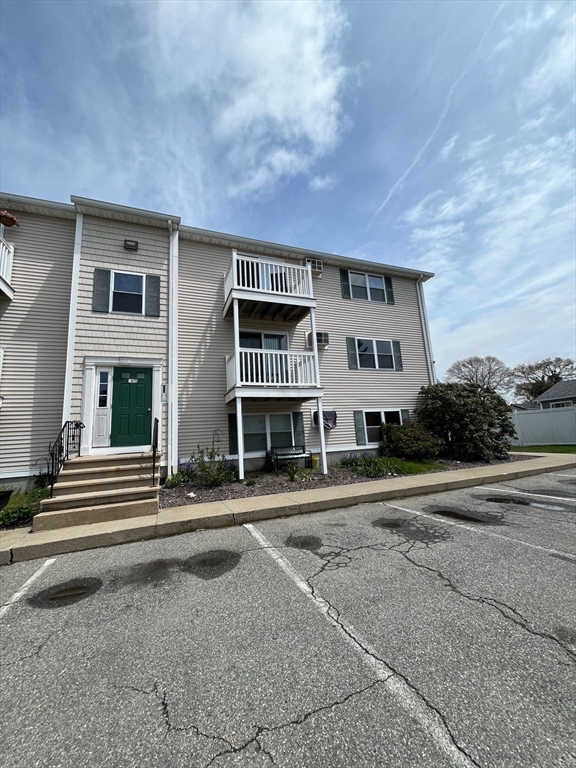 1475 Braley Road, Unit 17 New Bedford, MA 02745 - Photo 9 of 9 a front view of residential houses with street