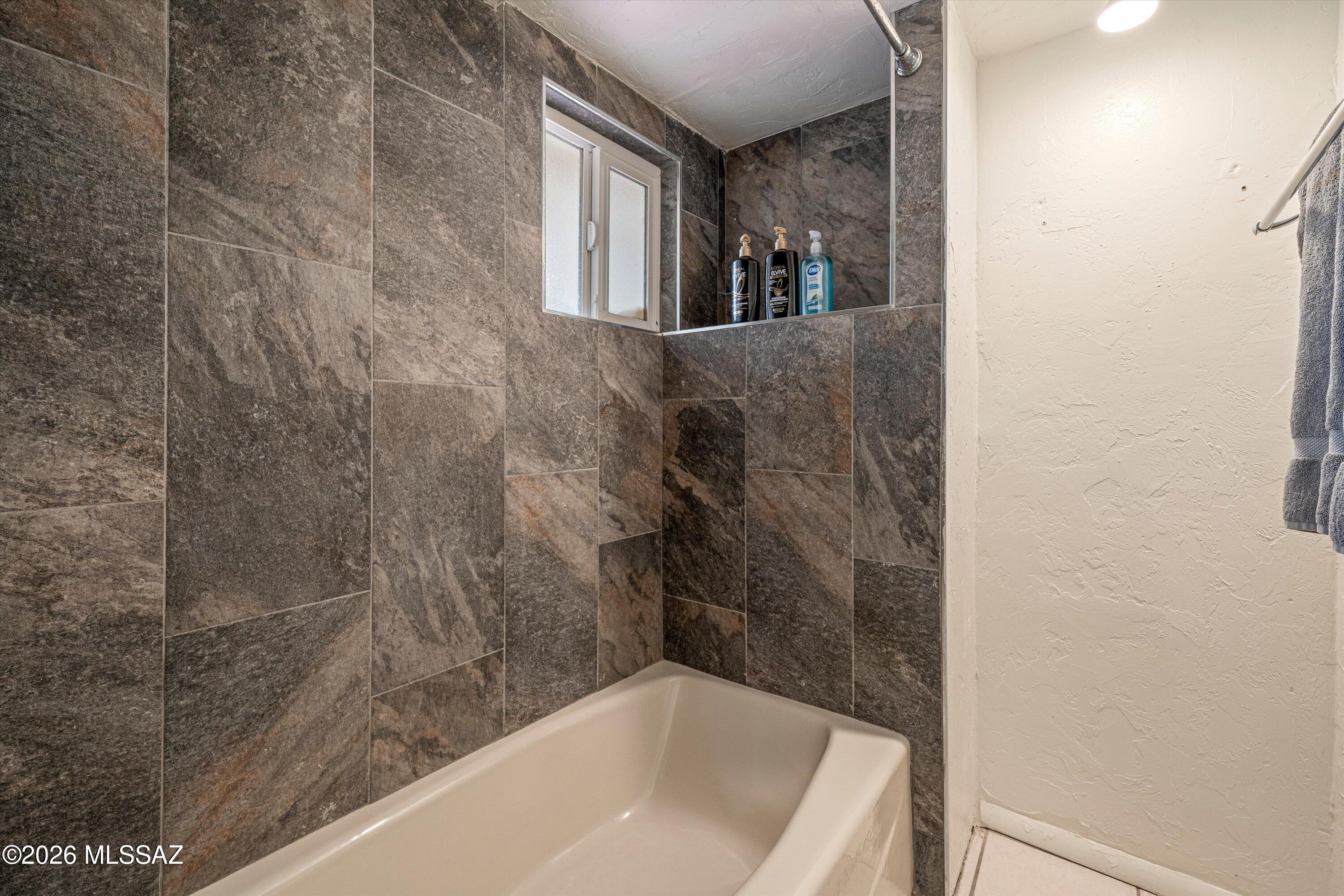 2619 East Prince Road Tucson, AZ 85716 - Photo 26 of 50 a bathroom with a bathtub
