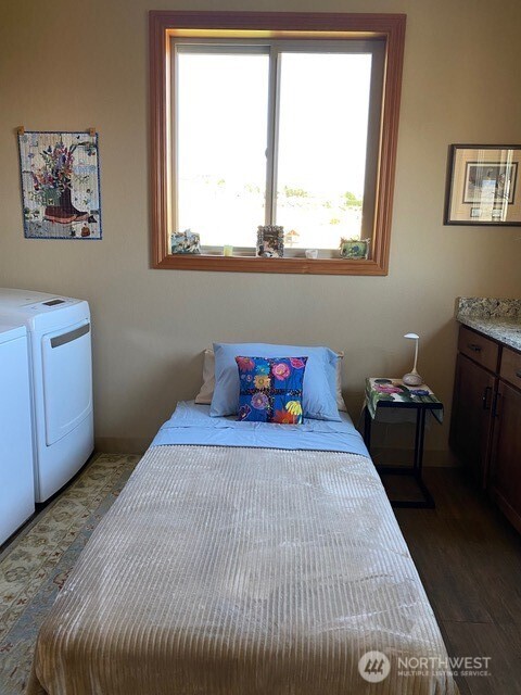 4062 Knowles Road Wenatchee, WA 98801 - Photo 12 of 20 a bedroom with a bed and wooden floor
