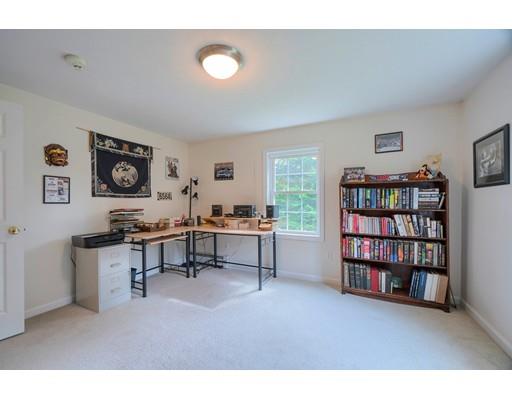 13 Flat Rock Road Petersham, MA 01366 - Photo 15 of 29 a living room with furniture and a book shelf