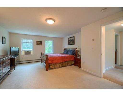 13 Flat Rock Road Petersham, MA 01366 - Photo 19 of 29 a spacious bedroom with a bed and wooden floor
