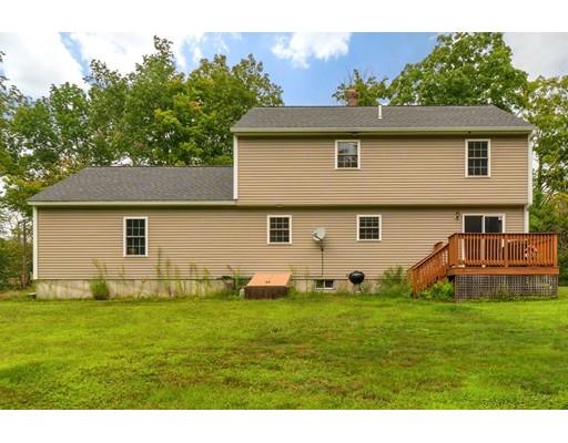 13 Flat Rock Road Petersham, MA 01366 - Photo 28 of 29 a front view of a house with a yard and trees