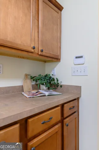 a kitchen with stainless steel appliances granite countertop a refrigerator and a stove