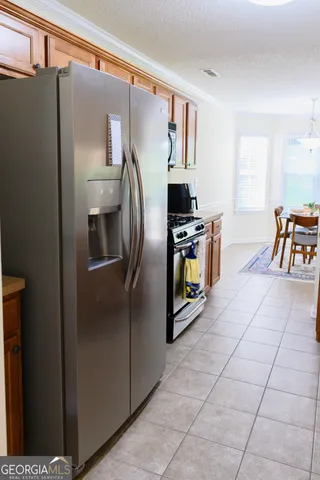 a kitchen with a stove and a microwave