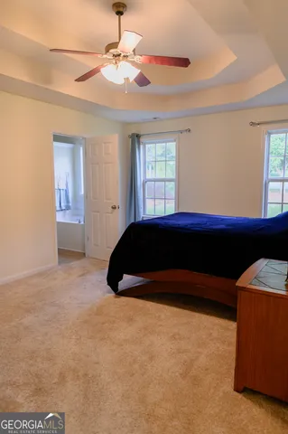 a bathroom with a tub and a window
