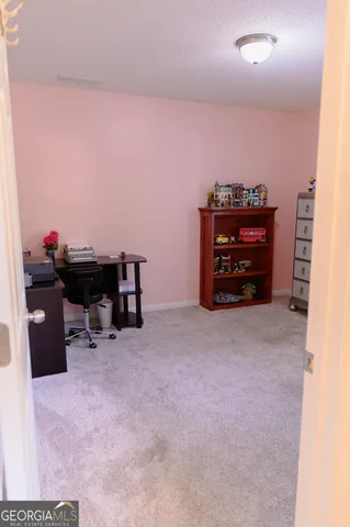 a bathroom with a toilet and a mirror