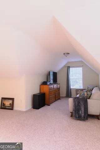 a white toilet sitting next to a shower curtain