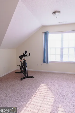 a view of a swimming pool with a lounge chair