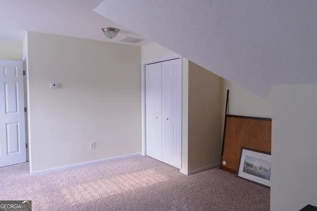 a view of yard with large trees