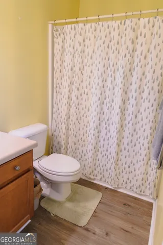 an aerial view of a house with swimming pool garden and lake view