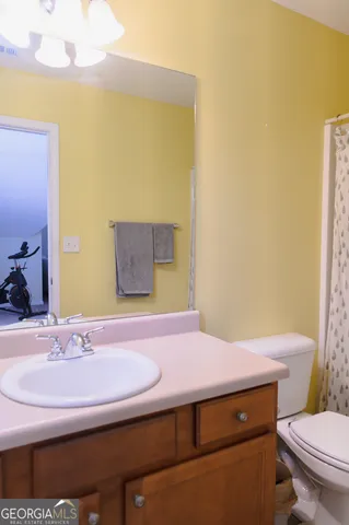 a view of house with garden space and street view