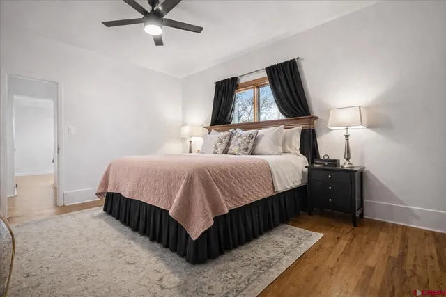 a bathroom with a sink a toilet and shower curtain