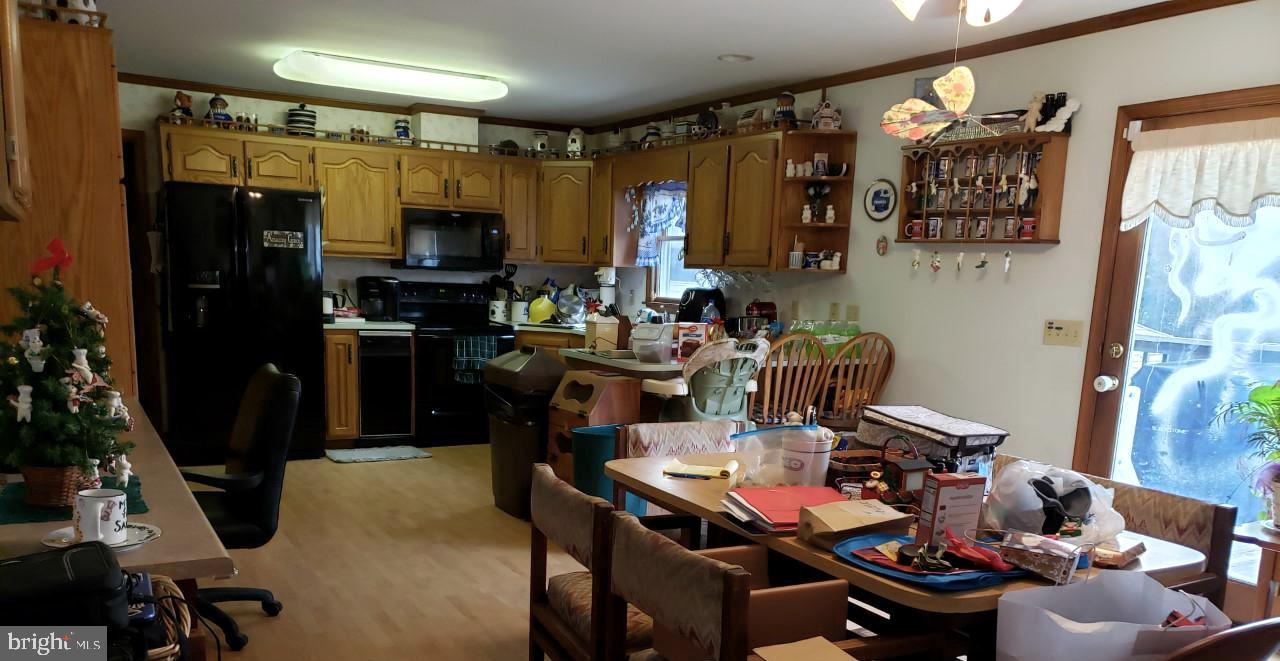 14924 Cherry Lane Ridgely, MD 21660 - Photo 19 of 43 Kitchen with dining area showing door to deck