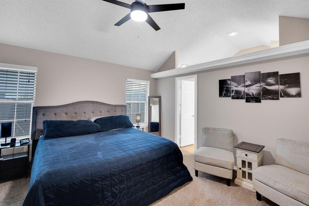 1001 Short Line Boulevard Midlothian, TX 76065 - Photo 5 of 26 Vaulted ceiling bedroom featuring light beige walls and carpeting