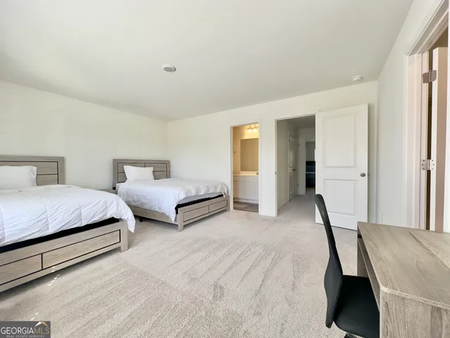 a spacious bedroom with a bed and a closet