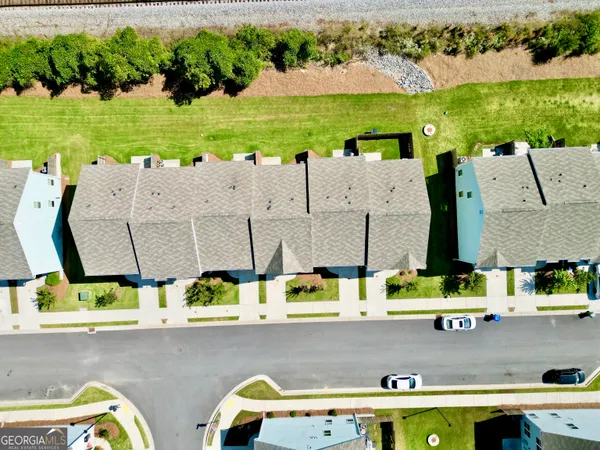 an aerial view of residential house with outdoor space and swimming pool
