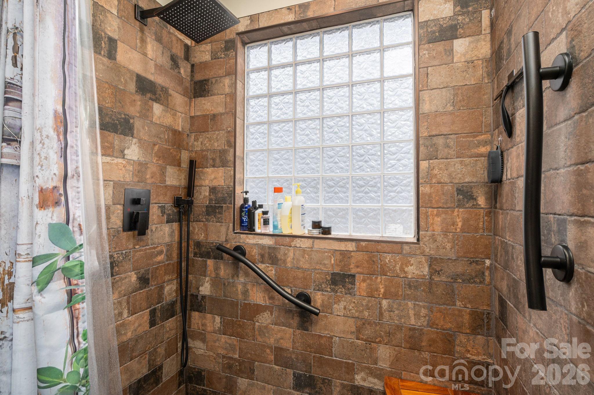 2033 Puetts Chapel Road Bessemer City, NC 28016 - Photo 12 of 38 a bathroom with a bathtub and shower