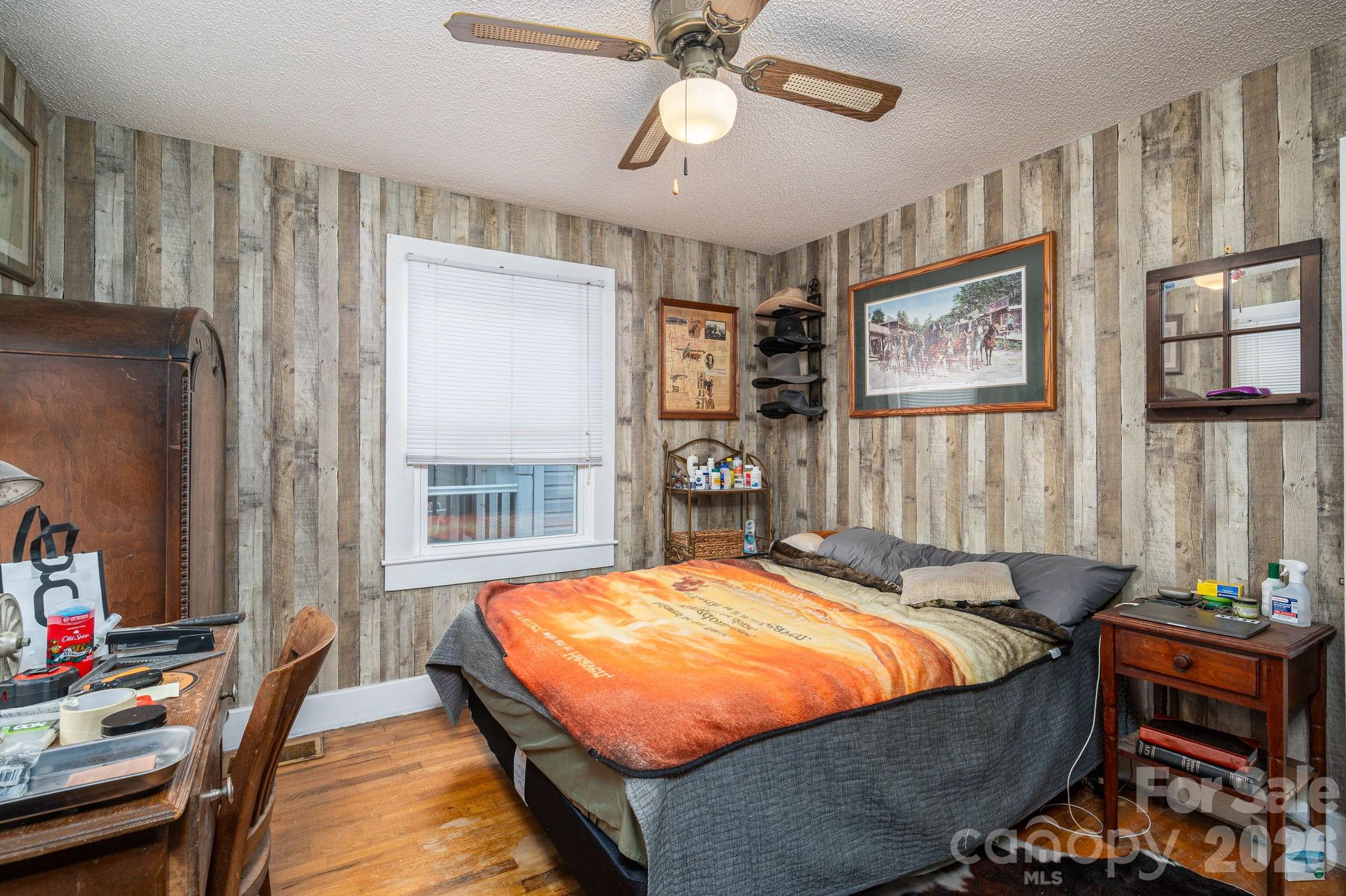 2033 Puetts Chapel Road Bessemer City, NC 28016 - Photo 16 of 38 a bed sitting in a bedroom next to a window