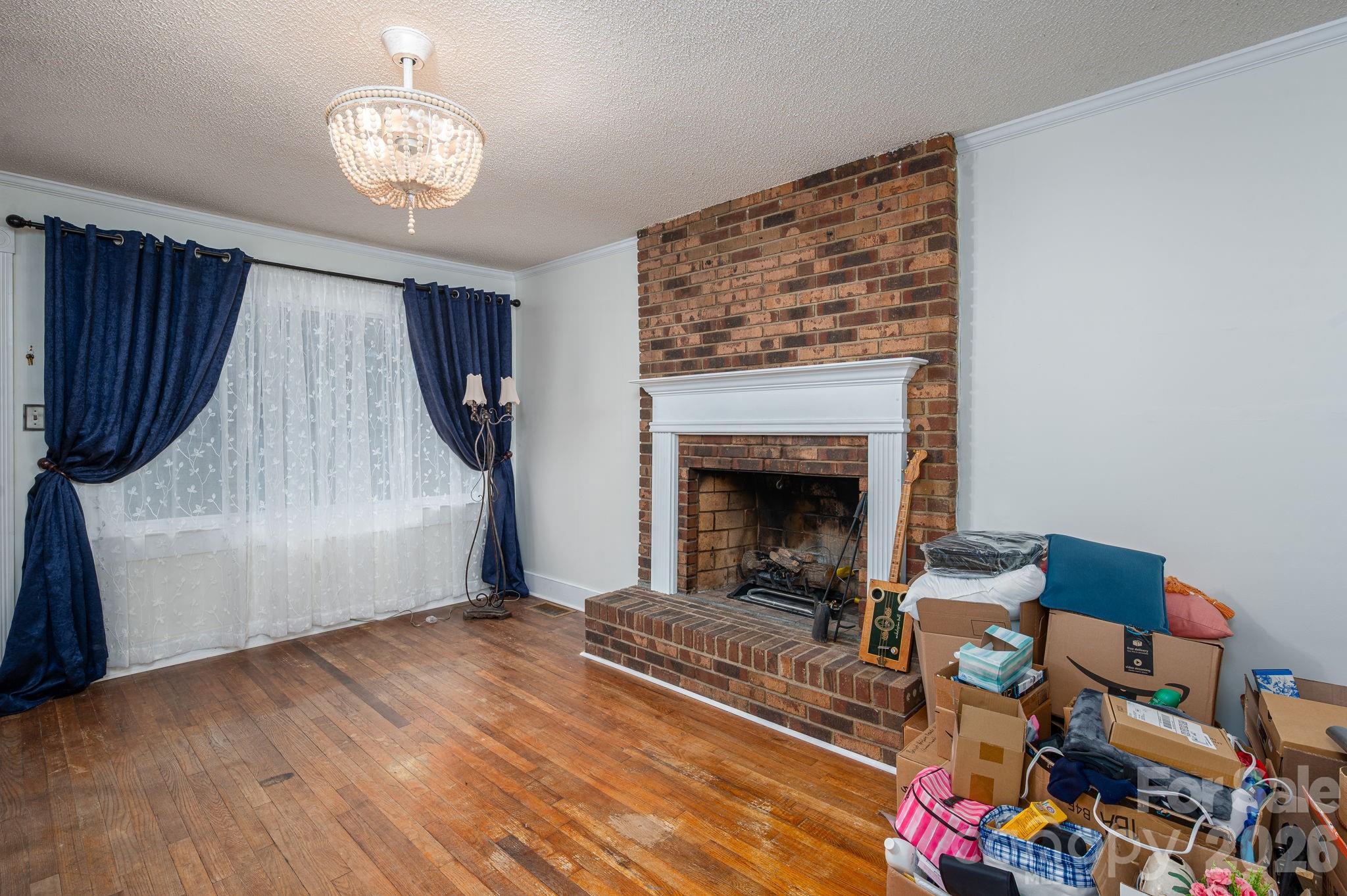 2033 Puetts Chapel Road Bessemer City, NC 28016 - Photo 19 of 38 a living room with furniture and a fireplace