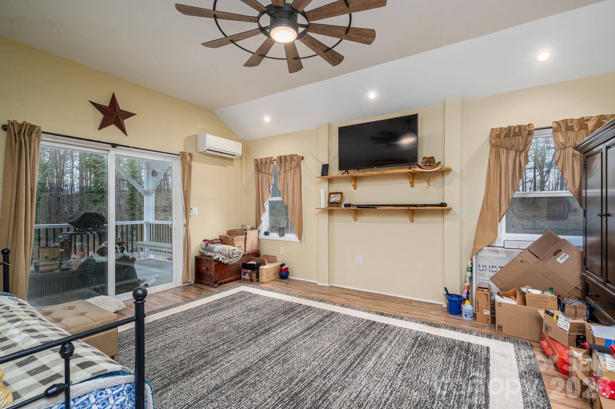 2033 Puetts Chapel Road Bessemer City, NC 28016 - Photo 20 of 38 a living room with furniture and a flat screen tv