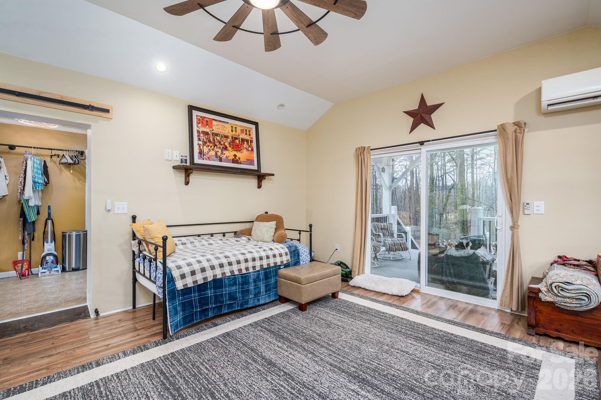 2033 Puetts Chapel Road Bessemer City, NC 28016 - Photo 21 of 38 a bedroom with a bed and wooden floor