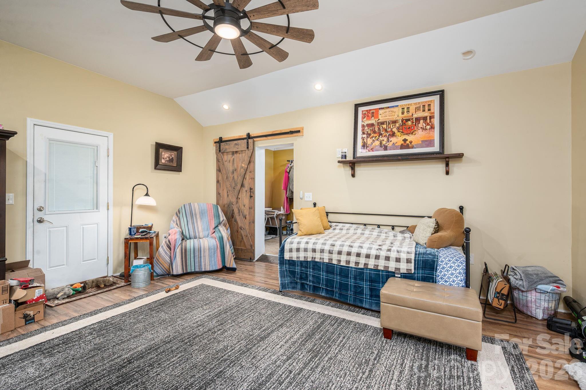 2033 Puetts Chapel Road Bessemer City, NC 28016 - Photo 22 of 38 a bedroom with furniture and wooden floor